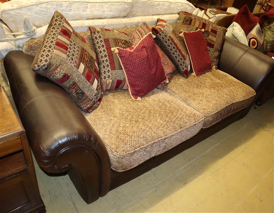 A brown leather upholstered settee, with fabric upholstered cushion seats, W.220cm